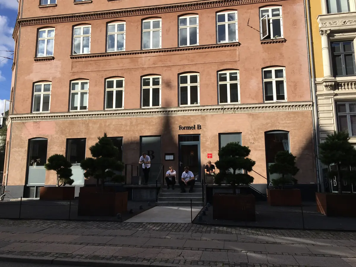 Formel B's red-brick corner building with planters out front, Copenhagen, 2019