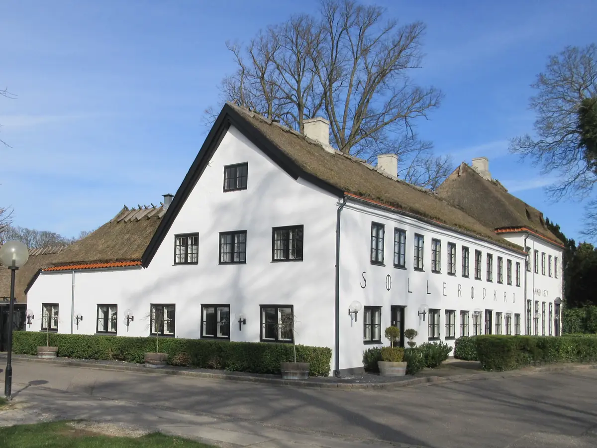 Søllerød Kro, a long white historic inn with its name painted on the façade, north of Copenhagen